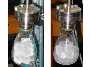 The authors of a new paper placed ice from subsections of Greenland ice cores in glass flasks. Under a vacuum, the ice melted, releasing the air trapped within the ice. The scientists used the trapped air to calculate the island's temperatures for the past 2,100 years and compare them to vacillations in solar activity. <br />  <em>Credit: Takuro Kobashi</em>