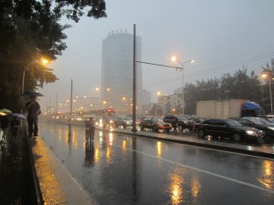 A monsoon pours down over Beijing's streets