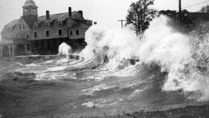 Waves crashing onshore in Woods Hole, Mass., during the 1938 hurricane. Large waves associated with intense hurricanes can erode and transport coastal sediments, as well as destroy infrastructure and threaten lives. Sediment transported by storm surge and waves  can be washed into coastal ponds and marshes, preserving a record of the storms passage. A new study examining these sediments found that intense hurricanes possibly more powerful than any storms New England has experienced in recorded history frequently pounded the region during the first millennium. Credit: WHOI