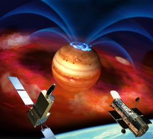 In this artist’s rendering, flows of electrically charged ions and electrons accelerate along Jupiter’s magnetic field lines (fountain-like blue curves), triggering auroras (blue rings) at the planet’s pole. Accelerated particles come from clouds of material (red) spewed from volcanoes on Jupiter’s moon Io (small orb to right). Recent observations of extreme ultraviolet emissions from Jupiter by satellite Hisaki (left foreground) and the Hubble Space Telescope (right) show episodes of sudden brightening of the planet’s auroras. Interactions with the excited particles from Io likely also fuel these auroral explosions, new research shows, not interactions with particles from the Sun. Credit: Japan Aerospace Exploration Agency 