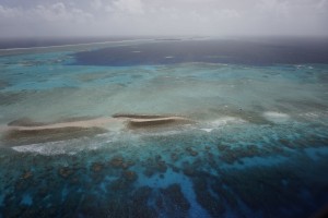 Aerial photograph of Kwajalein Atoll showing its low-lying islands and coral reefs. Credit: Curt Storlazzi/USGS
