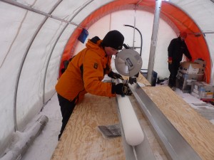 Liz Thomas measuring an ice core in the field. Credit: Liz Thomas 
